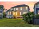 Back exterior featuring a well-maintained lawn, showcasing the home's inviting outdoor space, blending seamlessly with the surrounding nature at 2131 Pentland Dr, Charleston, SC 29412