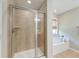 Bathroom featuring glass enclosed shower with decorative tile and bathtub at 2131 Pentland Dr, Charleston, SC 29412
