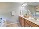 Bright bathroom features a double vanity, large mirror, and bathtub with shower at 2131 Pentland Dr, Charleston, SC 29412