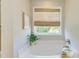 Bright bathroom features a luxurious tub with window views and elegant decor at 2131 Pentland Dr, Charleston, SC 29412
