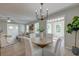 Bright dining area with modern light fixture and view to living area offers an inviting and stylish space for meals and gatherings at 2131 Pentland Dr, Charleston, SC 29412