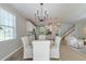 Inviting dining area with open views of the modern kitchen and staircase at 2131 Pentland Dr, Charleston, SC 29412