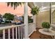 Charming front porch with decorative plants and comfortable seating, creating a welcoming outdoor space at 2131 Pentland Dr, Charleston, SC 29412