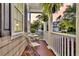 Cozy front porch featuring inviting seating, decorative plants, and a glimpse of the surrounding neighborhood at 2131 Pentland Dr, Charleston, SC 29412