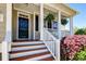 Inviting front porch with white columns, wooden stairs, and decorative plants enhancing curb appeal at 2131 Pentland Dr, Charleston, SC 29412