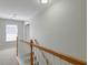 Upstairs hallway with neutral paint and stairs leading to the next level with plenty of natural light at 2131 Pentland Dr, Charleston, SC 29412