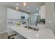 Beautiful white kitchen island featuring a stainless steel sink and pendant lighting at 2131 Pentland Dr, Charleston, SC 29412