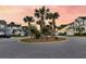 Neighborhood featuring landscaped cul-de-sac, palm trees, and well-maintained homes at 2131 Pentland Dr, Charleston, SC 29412