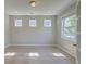 Bright office space with wood floors, recessed lighting, and a large window overlooking greenery at 2131 Pentland Dr, Charleston, SC 29412