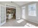 Bright room featuring french doors with open views into the kitchen and dining area at 2131 Pentland Dr, Charleston, SC 29412