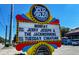 Bright and colorful sign for The Pour House, highlighting live music and deck stage, attracting visitors with lively entertainment at 2131 Pentland Dr, Charleston, SC 29412