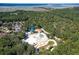 Aerial view of a community waterpark featuring a waterslide and lazy river surrounded by lush greenery at 2131 Pentland Dr, Charleston, SC 29412