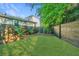 This fenced backyard features a lush green lawn, offering a secure and picturesque outdoor space at 2130 Weaver St, Charleston, SC 29403