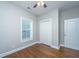 Bright bedroom features hardwood floors, window, closet and fresh neutral paint at 2130 Weaver St, Charleston, SC 29403