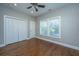 Bright bedroom features hardwood floors, two windows, closet and fresh neutral paint at 2130 Weaver St, Charleston, SC 29403