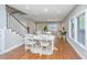 Open concept dining area with stylish decor and hardwood floors flowing into the living room at 2130 Weaver St, Charleston, SC 29403