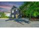 Charming two-story home with a yellow front door, neat landscaping and private driveway at 2130 Weaver St, Charleston, SC 29403