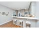 Well-lit kitchen with sleek white countertop and seating perfect for entertaining at 2130 Weaver St, Charleston, SC 29403
