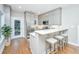 Modern kitchen featuring stainless steel appliances, breakfast bar with seating, and natural light at 2130 Weaver St, Charleston, SC 29403