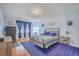 This bedroom features hardwood floors and a large window that provides great natural light at 2150 Spoleto Ln # B-11, North Charleston, SC 29406