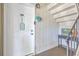 Front door with welcome decor and staircase leading up to the living area at 2150 Spoleto Ln # B-11, North Charleston, SC 29406