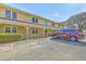 Two-story home with covered entryway, ample parking and a red SUV in the lot at 2150 Spoleto Ln # B-11, North Charleston, SC 29406