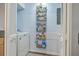 Pantry boasts shelving with canned goods and cleaning supplies, and a washing machine at 2150 Spoleto Ln # B-11, North Charleston, SC 29406