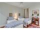 Charming bedroom with two twin beds, complemented by patterned bedding and cozy decor at 23 Savage St, Charleston, SC 29401