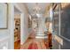 Elegant foyer with a chandelier, hardwood floors, and a grand staircase at 23 Savage St, Charleston, SC 29401