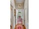 Hallway view of open floor plan with beautiful floors and elegant archway to the kitchen at 23 Savage St, Charleston, SC 29401