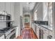 Stylish kitchen featuring stainless steel appliances, modern cabinetry, and hardwood floors at 23 Savage St, Charleston, SC 29401