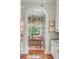 Charming breakfast nook with window seating and elegant chandelier, adjacent to the kitchen at 23 Savage St, Charleston, SC 29401