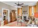 Cozy living room featuring decorative fireplace, hard wood floors, and detailed finishes at 23 Savage St, Charleston, SC 29401