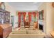 Charming living room with detailed millwork, a fireplace, and elegant furnishings at 23 Savage St, Charleston, SC 29401