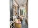 Inviting screened porch with comfortable wicker seating and ceiling fan at 23 Savage St, Charleston, SC 29401
