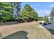 Large backyard with ample space for outdoor activities, surrounded by mature trees and greenery at 239 Sea Lavender Ln, Summerville, SC 29486