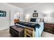 Inviting bedroom with ensuite bathroom view, offering bedside table and a decorative chest at 239 Sea Lavender Ln, Summerville, SC 29486