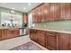 Eat-in kitchen with tile flooring, granite countertops, wood cabinetry, and stainless appliances at 239 Sea Lavender Ln, Summerville, SC 29486