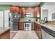Bright kitchen with granite countertops, stainless appliances, and tile flooring at 239 Sea Lavender Ln, Summerville, SC 29486