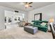 Cozy living room featuring natural lighting, carpet floors and comfortable seating at 239 Sea Lavender Ln, Summerville, SC 29486