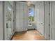 Cozy entryway with built-in bench, storage cabinets, and a window seat for comfortable seating at 24 Chalmers St, Charleston, SC 29401