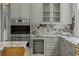 Modern kitchen features stainless steel appliances, marble countertops, wine fridge, and custom cabinets at 24 Chalmers St, Charleston, SC 29401