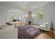 Spacious living room with hardwood floors, fireplace, large windows, and arched doorways, creating a luxurious and inviting atmosphere at 24 Chalmers St, Charleston, SC 29401