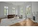 Bright living area featuring hardwood floors, large windows, modern fireplace, and elegant décor creating a comfortable atmosphere at 24 Chalmers St, Charleston, SC 29401