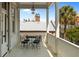 Charming porch featuring a wrought iron table and chairs, overlooking the neighborhood at 24 Chalmers St, Charleston, SC 29401