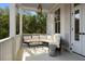 Comfortable outdoor porch with cushioned seating, perfect for relaxing and enjoying fresh air at 24 Chalmers St, Charleston, SC 29401