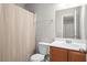 Well-maintained bathroom featuring a shower with curtain and vanity with a mirror and storage at 2505 Stadium Dr, North Charleston, SC 29406