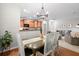 Cozy dining area with wood floors, modern lighting, and access to the kitchen at 2505 Stadium Dr, North Charleston, SC 29406