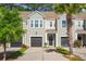 Charming townhome featuring a private entrance, garage, and well-manicured landscaping at 2505 Stadium Dr, North Charleston, SC 29406