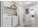 Upstairs hallway with a convenient laundry area and additional storage solutions at 2505 Stadium Dr, North Charleston, SC 29406